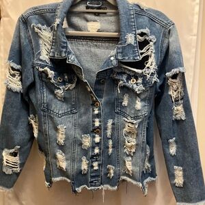 Distressed Jean jacket, denim size medium. With beaded pearls.